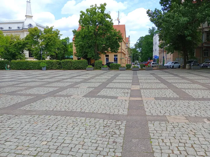View towards the trees and surrounding frontages at World War II memorial, Zielona Góra