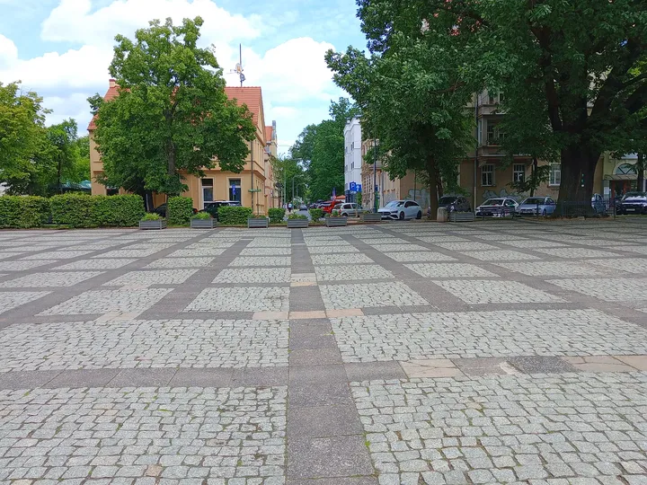 Patterned pavement across the square at World War II memorial, Zielona Góra