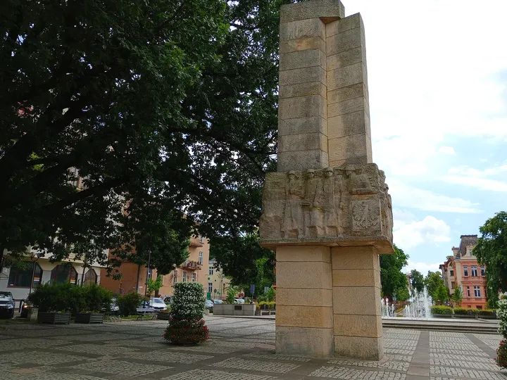 Carved memorial figures viewed from below at World War II memorial, Zielona Góra