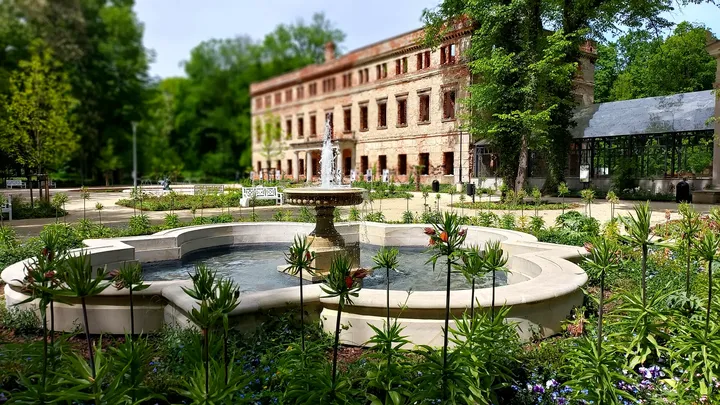 An earlier spring view brings the fountain, planting and palace into the same frame in Zatonie Ducal Park