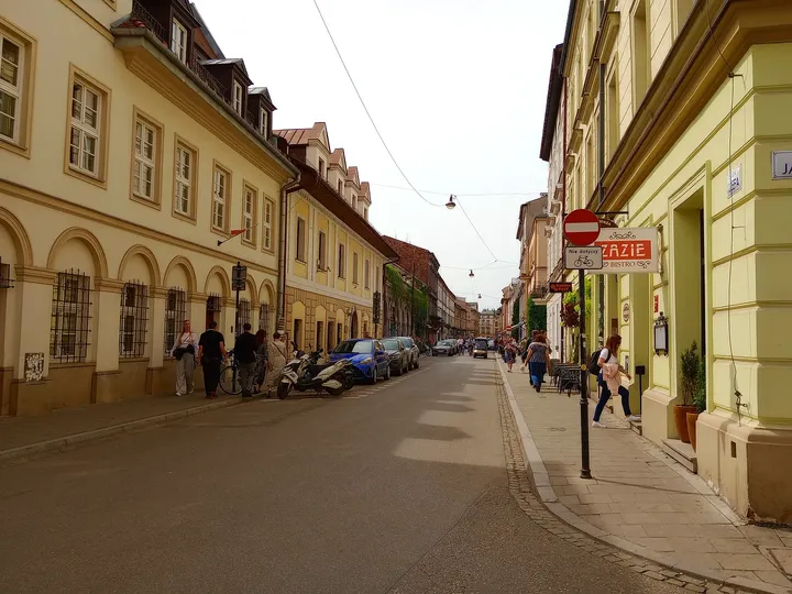 The bistro sign above a Kazimierz pavement at Zazie Bistro