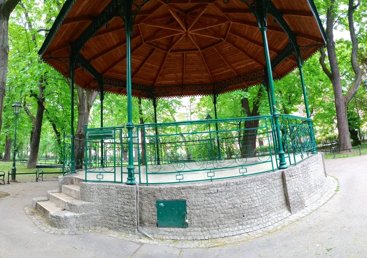 Open pavilion above its stone base at Zbigniew Wodecki Square