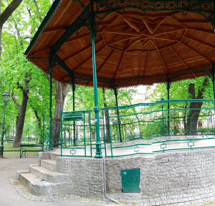 Green railings around the platform at Zbigniew Wodecki Square