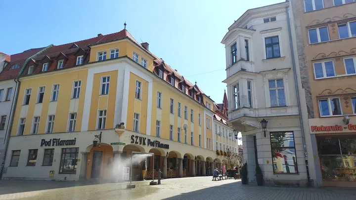 Townhouses facing the paved square at Zielona Góra Old Market Square