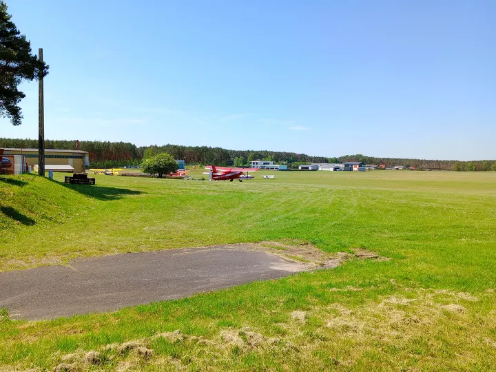 Picnic tables beside the open ground at Zielona Góra–Przylep airfield