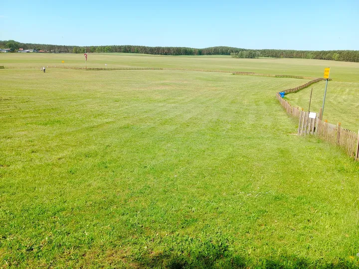 Grass beside the airfield fence at Zielona Góra–Przylep airfield