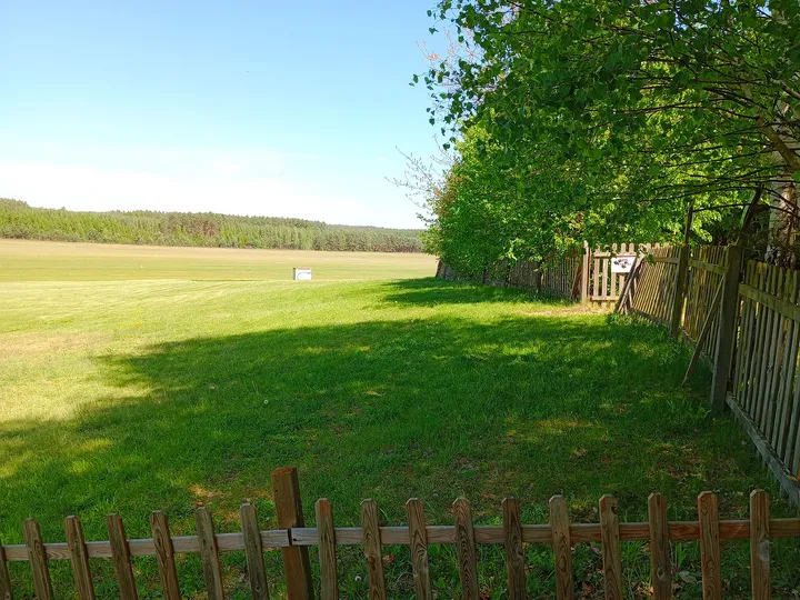 A shaded path beside the grounds at Zielona Góra–Przylep airfield
