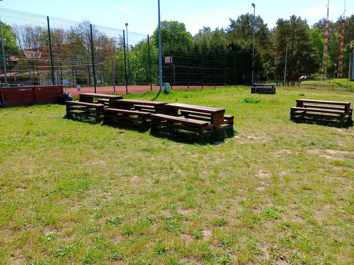 Rows of outdoor benches at Zielona Góra–Przylep airfield