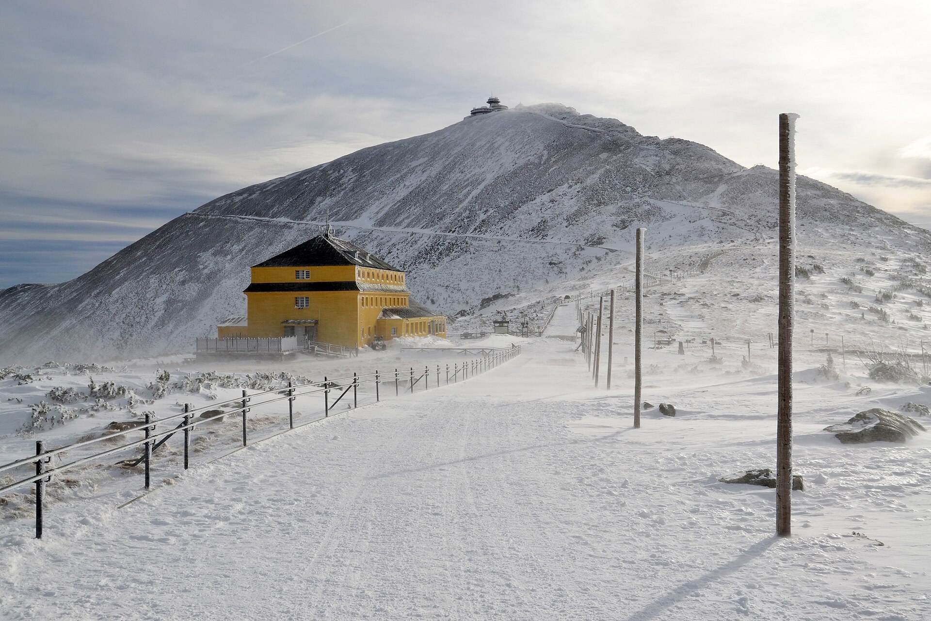 Snow-covered summit buildings on Śnieżka in the Karkonosze Mountains